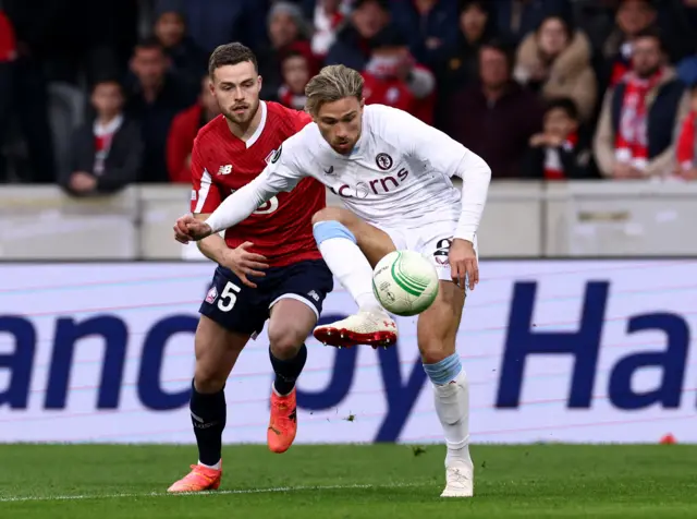 Aston Villa's Matty Cash in action with Lille's Gabriel Gudmundsson