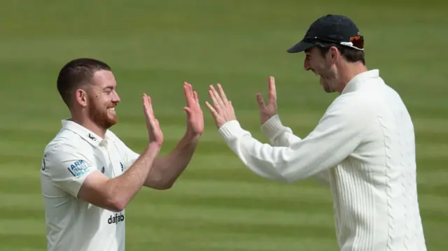 Ryan Higgins takes a wicket