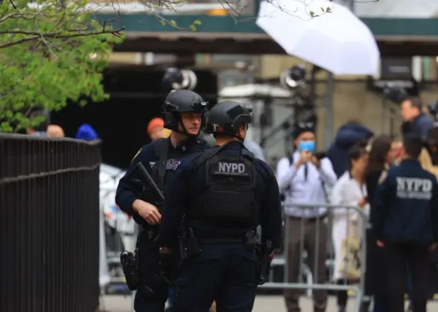 Firefighters intervene after a man person set himself on fire for an unknown reason in front of the NY court where former US President Donald Trump's trial held, and the police take precautions around the area in New York