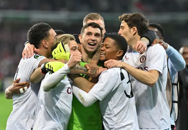 Emiliano Martinez celebrates his penalty shootout heroics for Aston Villa against Lille with his team-mates