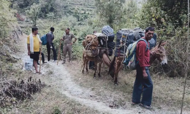 Officials going to a polling station in Bhimtal, Uttarakhand