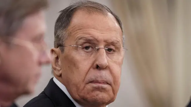 Russian Foreign Minister Sergei Lavrov looks straight on to a camera in close-up