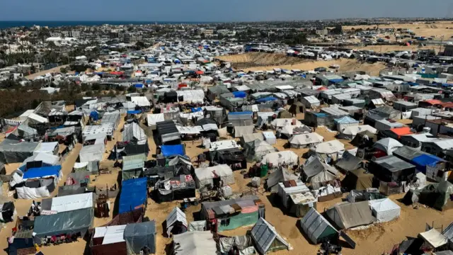 An aerial view of a tent camp