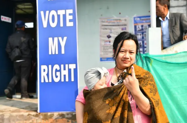 A woman in Manipur goes to cast her vote