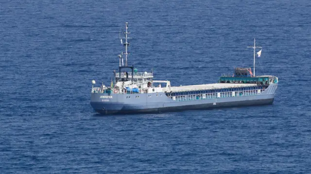 A cargo ship in the water