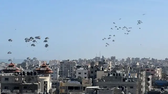 A view of humanitarian aid boxes dropped from a plane on the western Gaza Strip