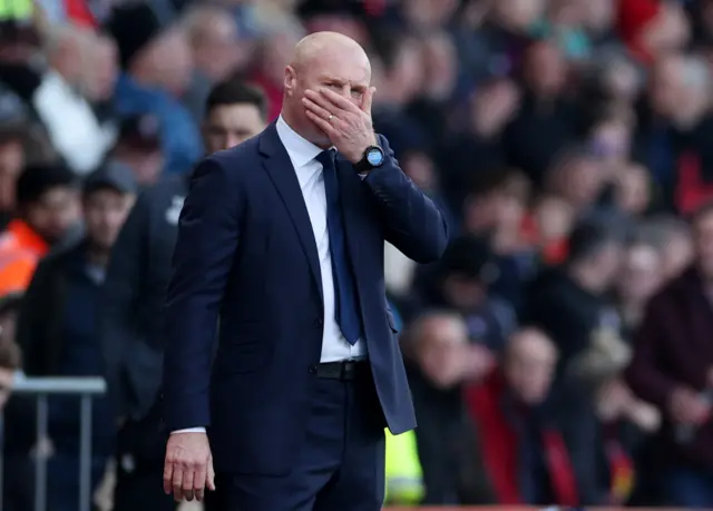 Dyche covers his mouth in disbelief