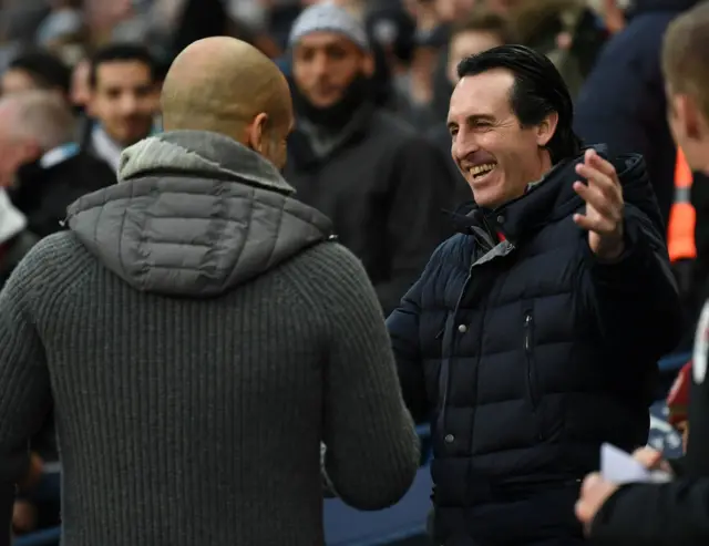 Unai Emery hugging Pep Guardiola