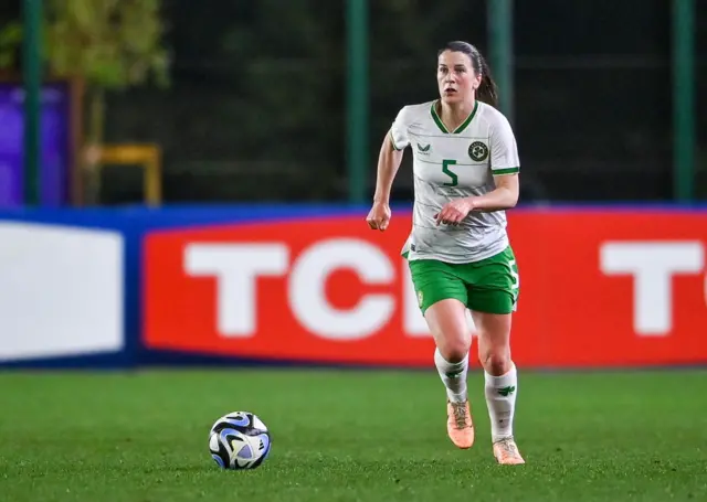 Niamh Fahey runs with the ball
