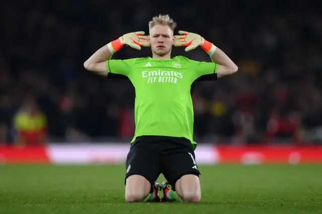 Aaron Ramsdale holds his hands up to his ears