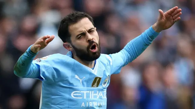 Bernardo Silva throws his arms in the air in frustration