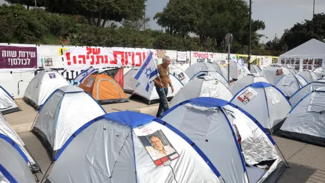 Tents with photos of hostages