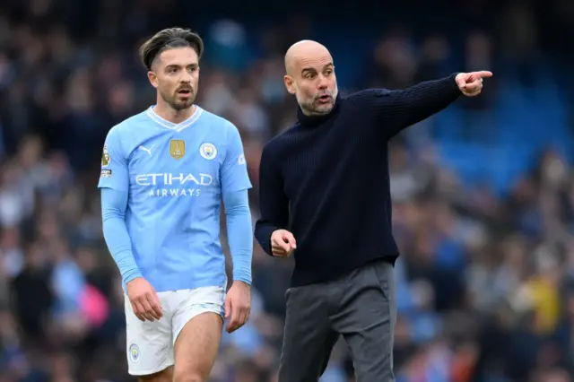 Jack Grealish with Pep Guardiola