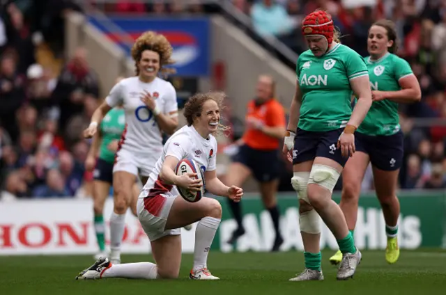 Abby Dow smiles after scoring a try