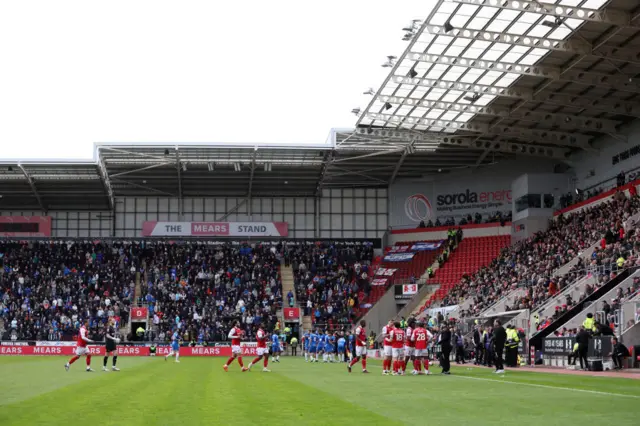 Players are called over to the side at the New York Stadium following a medical emergency