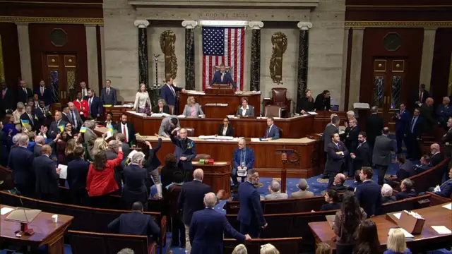 flags waved in the chamber when the vote passed