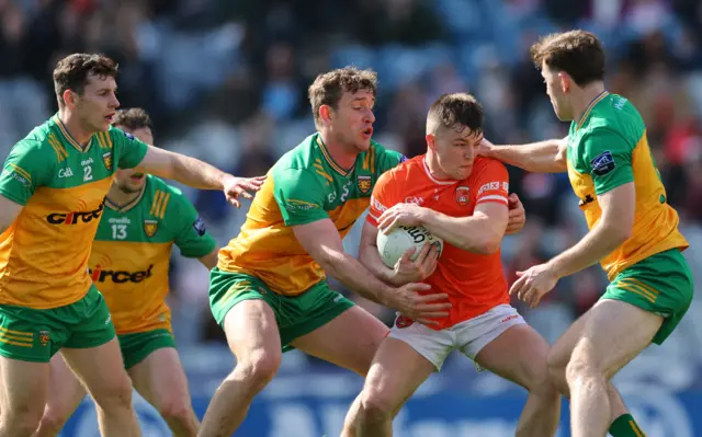 There's no way out for Armagh's Peter McGrane as Donegal players close in