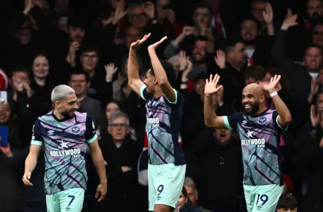 Brentford players celebrate their fifth goal