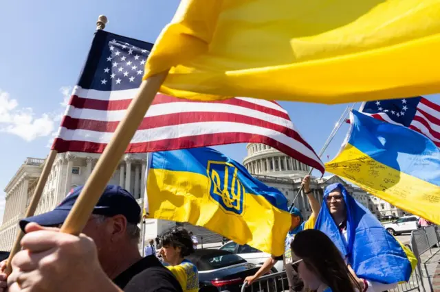 Supporters of Ukraine wave US and Ukrainian flags outside the US Capitol after the House approved foreign aid packages to Ukraine, as well as Israel and Taiwan in the US Capitol in Washington, DC, USA, 20 April 2024