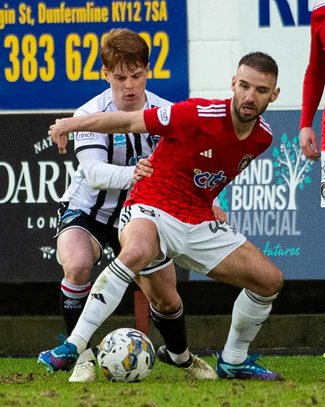 Dunfermline's Jake Sutherland and Queen's Park's Sean Welsh