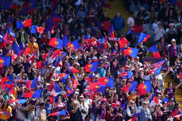 Barcelona fans wave flags ahead of kick off