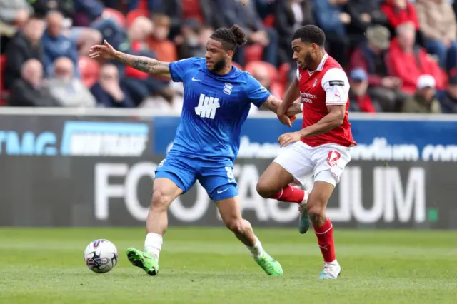 Birmingham's Tyler Roberts takes on Rotherham's Andy Rinomhota