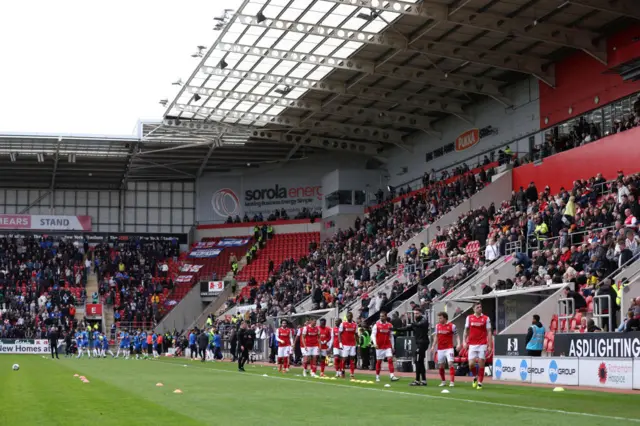 Players warm up at the New York Stadium following a medical emergency