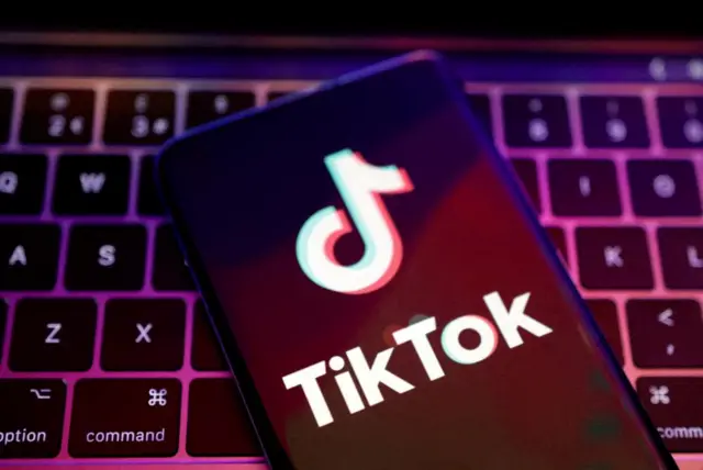 A phone displaying TikTok