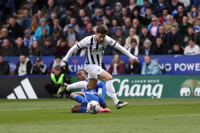 Mikey Johnston runs at the Leicester defence