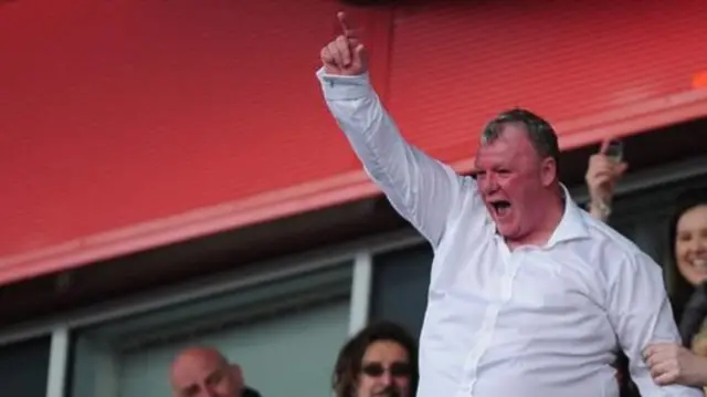 Steve Evans celebrates