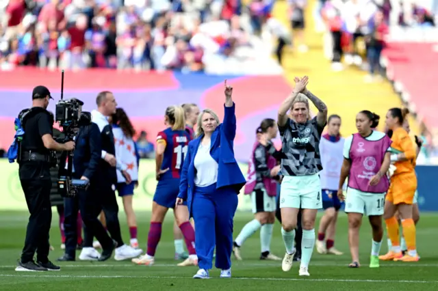 Hayes and Bright salute the travelling fans from the pitch at full time