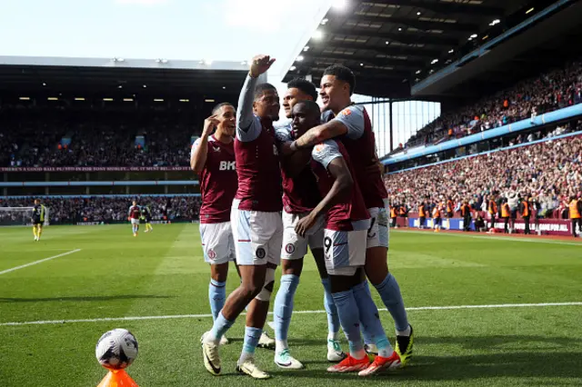 Moussa Diaby celebrates with Youri Tielemans, Leon Bailey, Ollie Watkins and Morgan Rogers