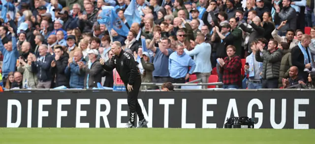 Mark Robins on the touchline