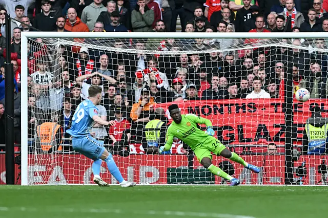 Andre Onana of Manchester United fails to save Coventry City's second penalty scored by Victor Torp