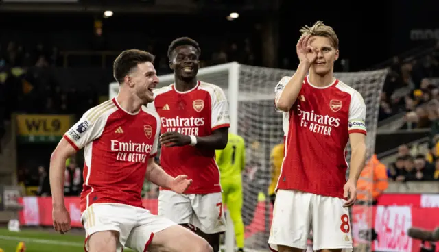 Arsenal's Martin Odegaard (right) celebrates scoring his side's second goal with team mates Declan Rice (left) and Bukayo Saka