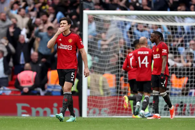 Harry Maguire of Manchester United looks dejected