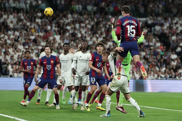 Andreas Christensen (R) heads the ball to scores