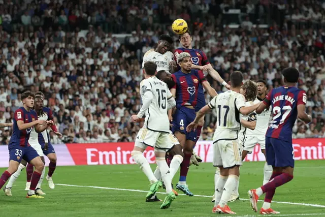 Barcelona's Polish forward Robert Lewandowski vies for a header