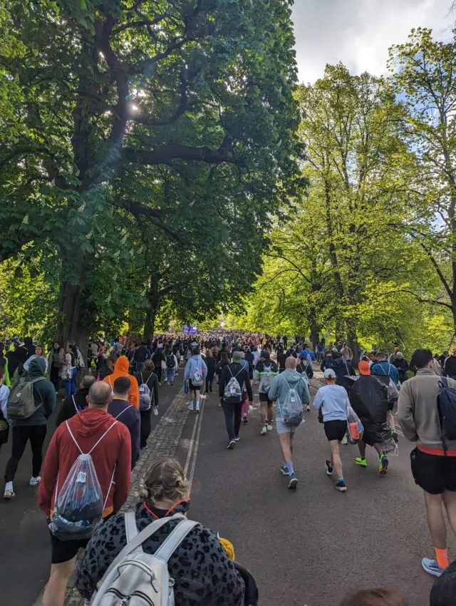 Runners walk to the start of the London Marathon