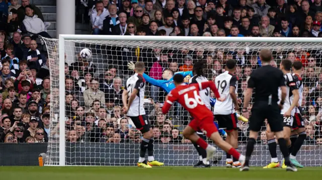 Liverpool's Trent Alexander-Arnold scores a free-kick against Fulham