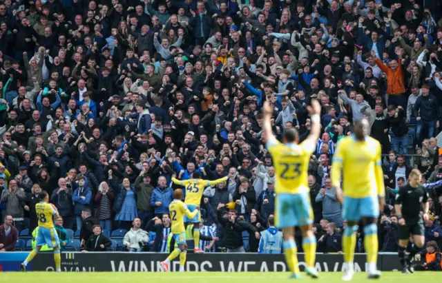 Sheffield Wednesday players and fans celebrate at Ewood Park