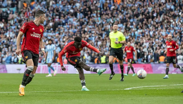 Manchester United's Omari Forson shoots at goal