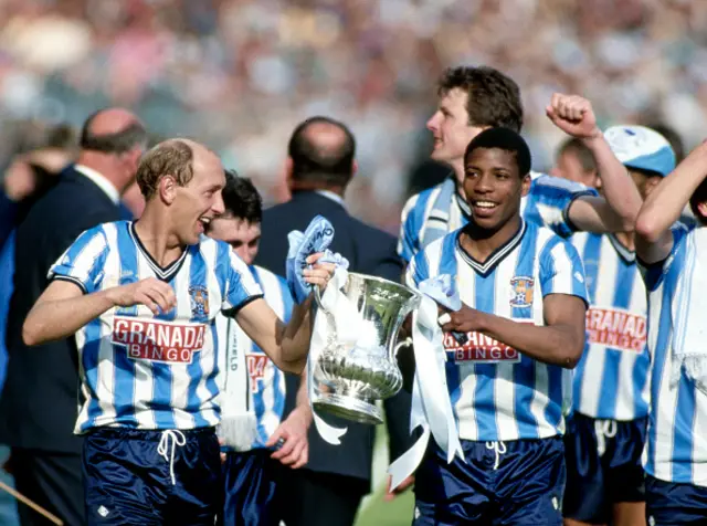 Coventry City players Greg Downs (l) and Lloyd McGrath pictured with the trophy