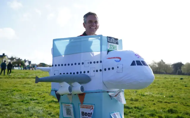 A runner at the London Marathon in a British Airways plane outfit