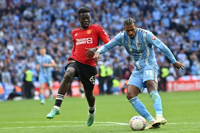 Haji Wright (R) vies with Manchester United's English midfielder Omari Forson