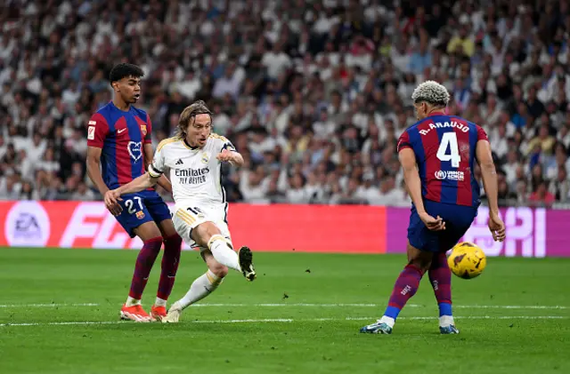 Luka Modric takes a shot at goal