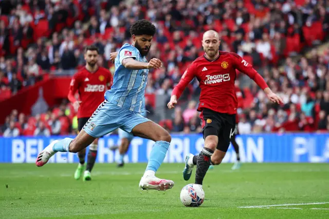 Ellis Simms of Coventry City shoots past Christian Eriksen