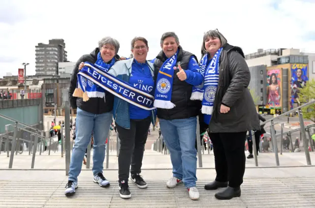 Leicester fans stand outside the emirates