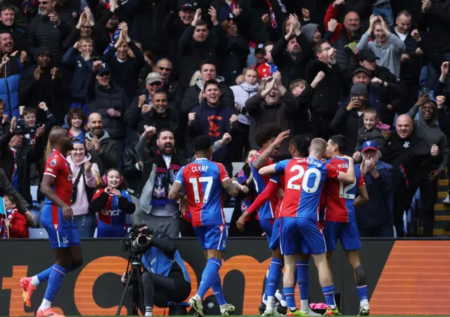 Michael Olise celebrates scoring their first goal with teammates