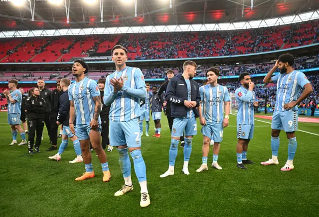 Luis Binks of Coventry City looks dejected with teammates